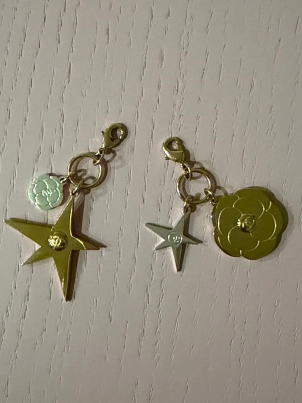 CHANEL Gold-Tone Star and Camellia Charm Pair